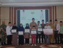 Pj Bupati Muaro Jambi Serahkan Bonus Kepada Kafilah MTQ Untuk Provinsi Jambi